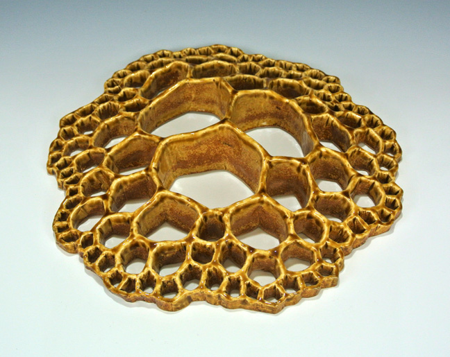 Organic-looking cellular ceramic sculpture based on a fractal tiling.